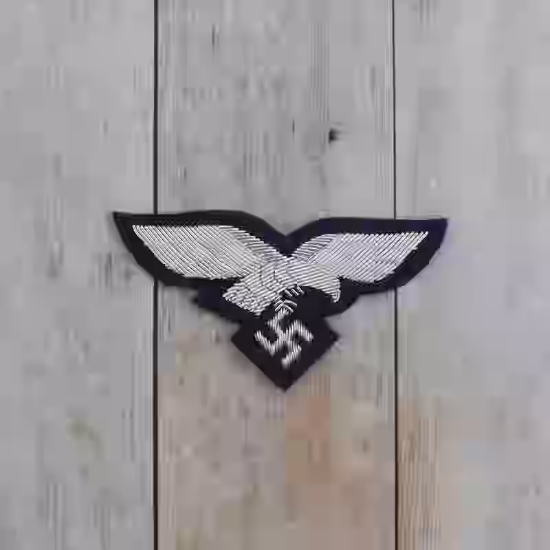 Luftwaffe Officer's Handmade Breast Eagle - WWII-era Luftwaffe officers handmade breast eagle with silver aluminum thread on darkblue wool background.