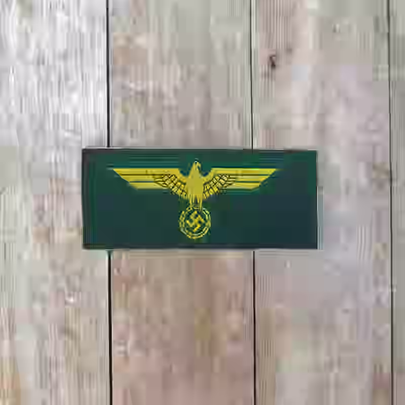 Coastal Artillery Enlisted Men's Silk Woven Breast Eagle - WWII-era Coastal Artillery enlisted men silk woven breast eagle with yellow eagle on green background.