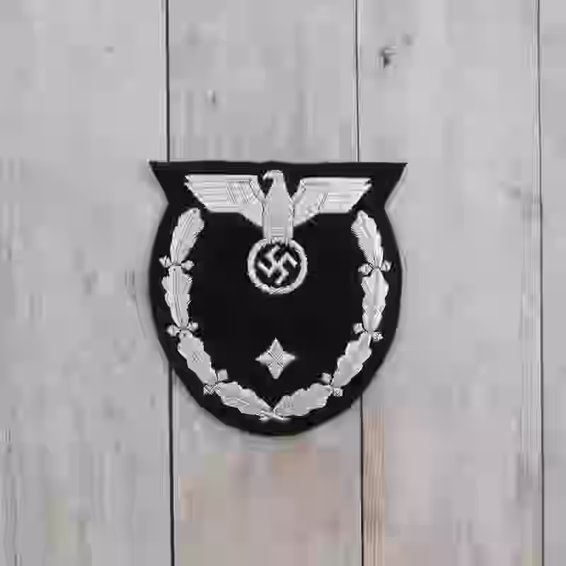 NSDAP Diplomatic Sleeve Eagle (1939-1945) - WWII-era NSDAP diplomatic sleeve eagle with silver embroidery on black wool for diplomatic ranks.