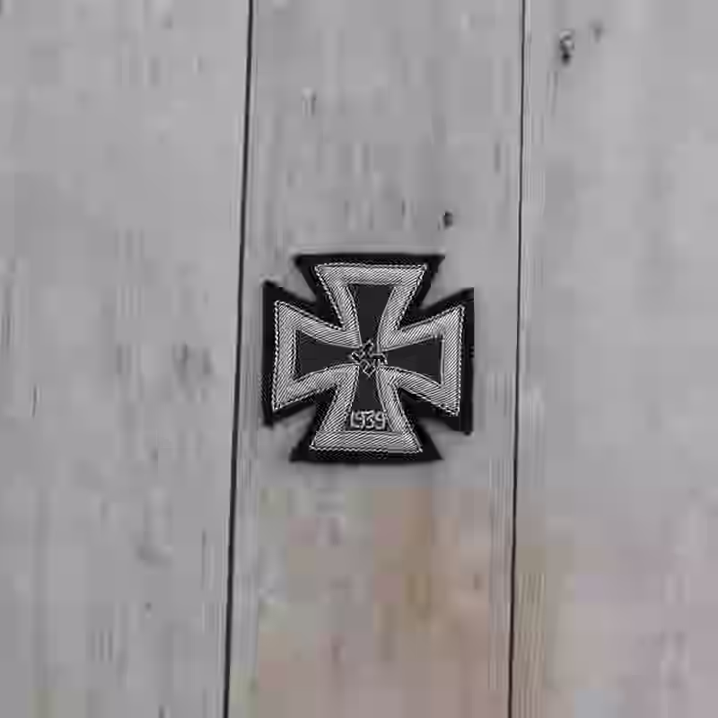 Embroidered 1st Class Cross 1939 - WWII-era 1st Class Iron Cross 1939 with silver thread and black flat center needle.