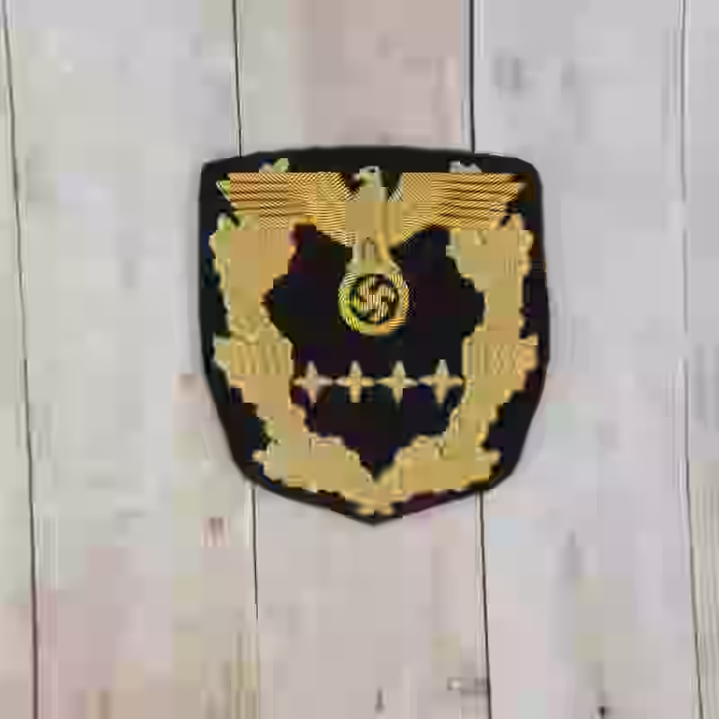 Reichsminister 1940-1942 Sleeve Rank Insignia - WWII-era Reichsminister sleeve rank insignia with gold thread on black background.