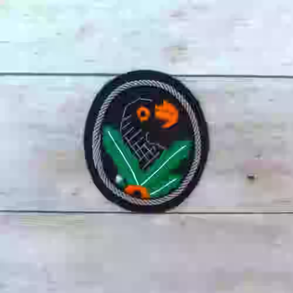 Second Class Sniper Badge with Silver Trim - WWII-era second-class sniper badge with silver cord trim for 40 enemy kills.