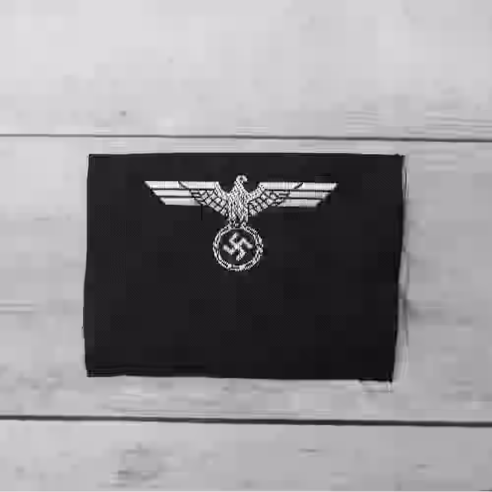 Panzer M35 Silk Woven Officer's Cap Insignia - WWII-era Panzer M35 silk woven cap insignia with silver eagle on black silk.