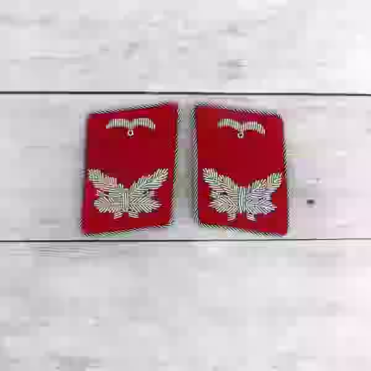 Luftwaffe Flak Leutnant Artillery Collar Tabs - WWII-era Luftwaffe Flak Leutnant artillery collar tabs with silver thread on red wool.