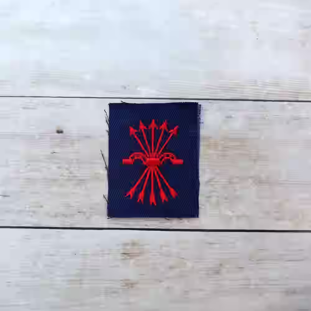Spanish Blue Division Enlisted Men's Falangist Breast Patch - WWII-era Spanish Blue Division Falangist breast patch with red embroidered emblem on black cotton.