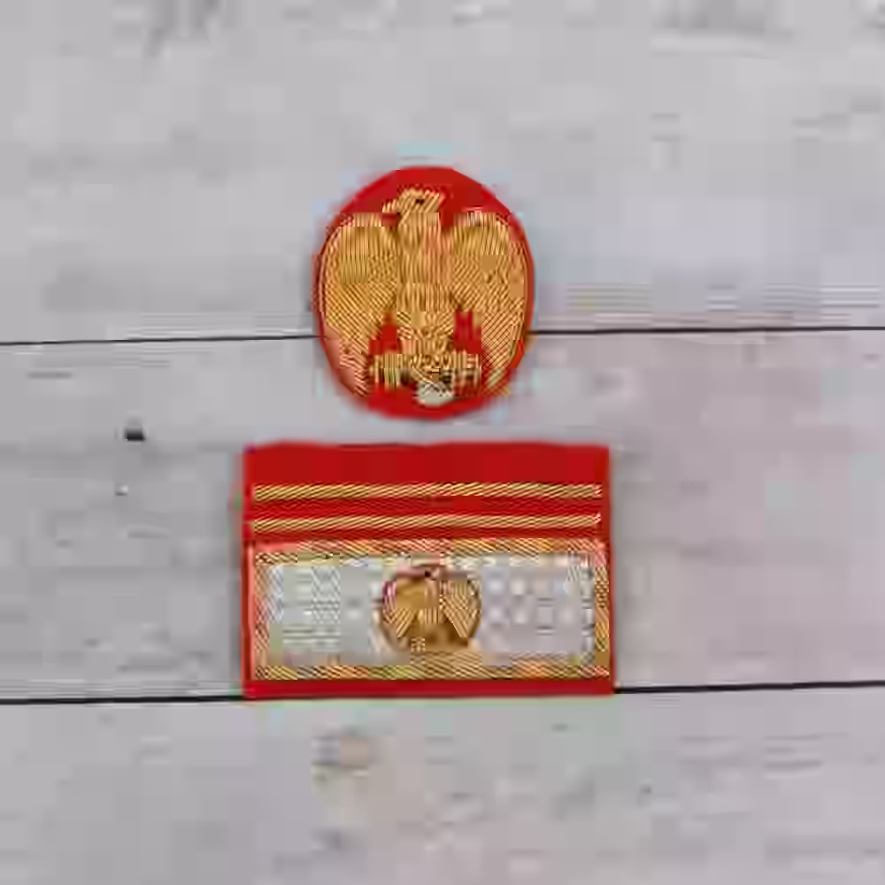 Italian MVSN General Cap Eagle and Sleeve Badge - Hand-embroidered Italian MVSN general cap eagle and sleeve badge on red wool with gold thread.