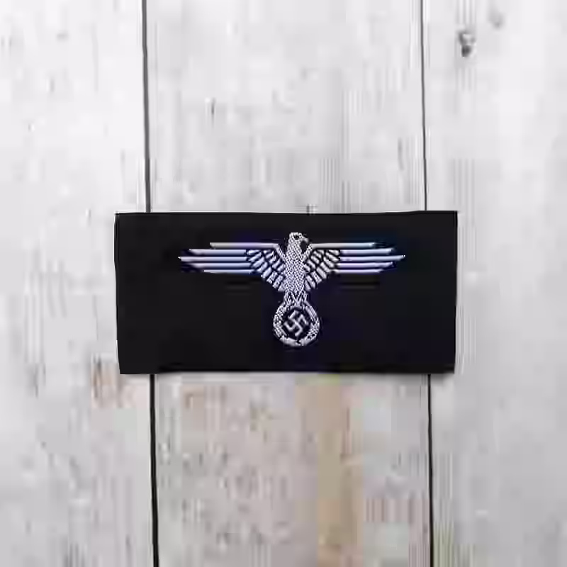 Waffen-SS Enlisted Men's Silk-Woven Cap Eagle - WWII-era Waffen-SS enlisted men’s silk-woven cap eagle with white eagle on black background for M40, M43, and M44 caps.