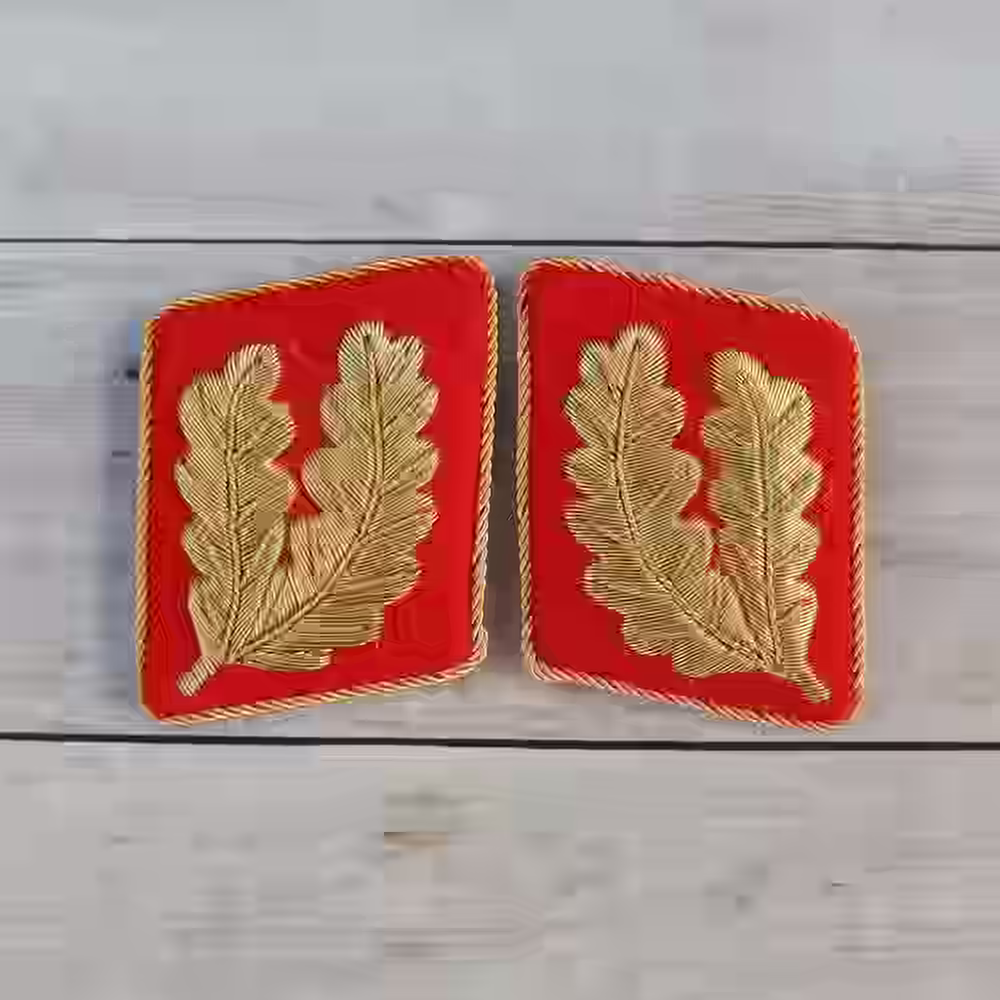 NSDAP 1939 Gauleiter Collar Tabs - Hand-embroidered NSDAP 1939 Gauleiter collar tabs with gold thread on red wool.