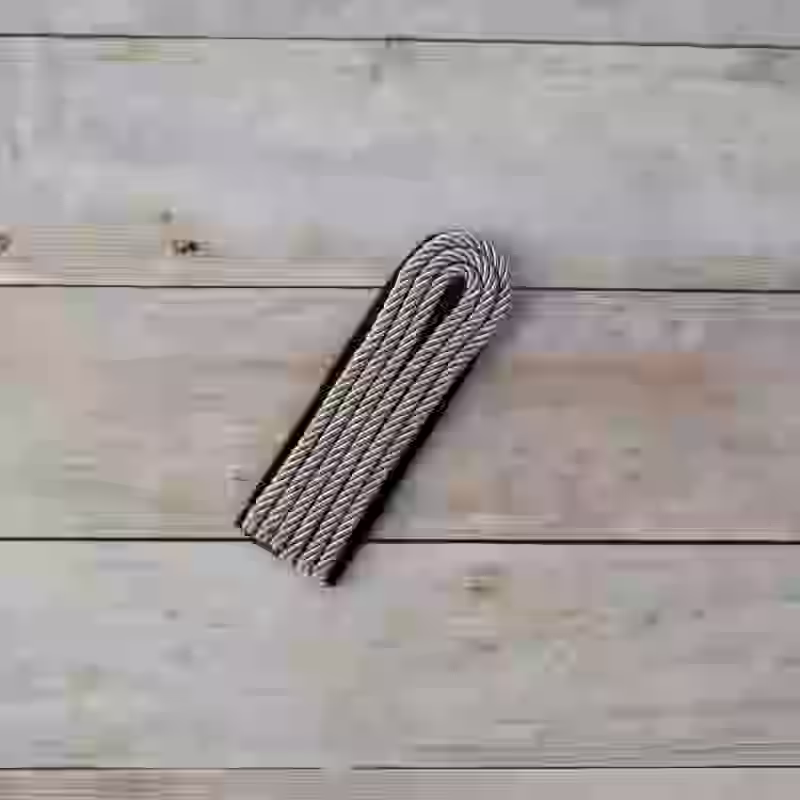 Allgemeine-SS Junior Officer's Single Shoulder Board - WWII-era Allgemeine SS junior officers’ single shoulder board with aluminum twist cord and black wool underlay for Untersturmführer to Hauptsturmführer ranks.