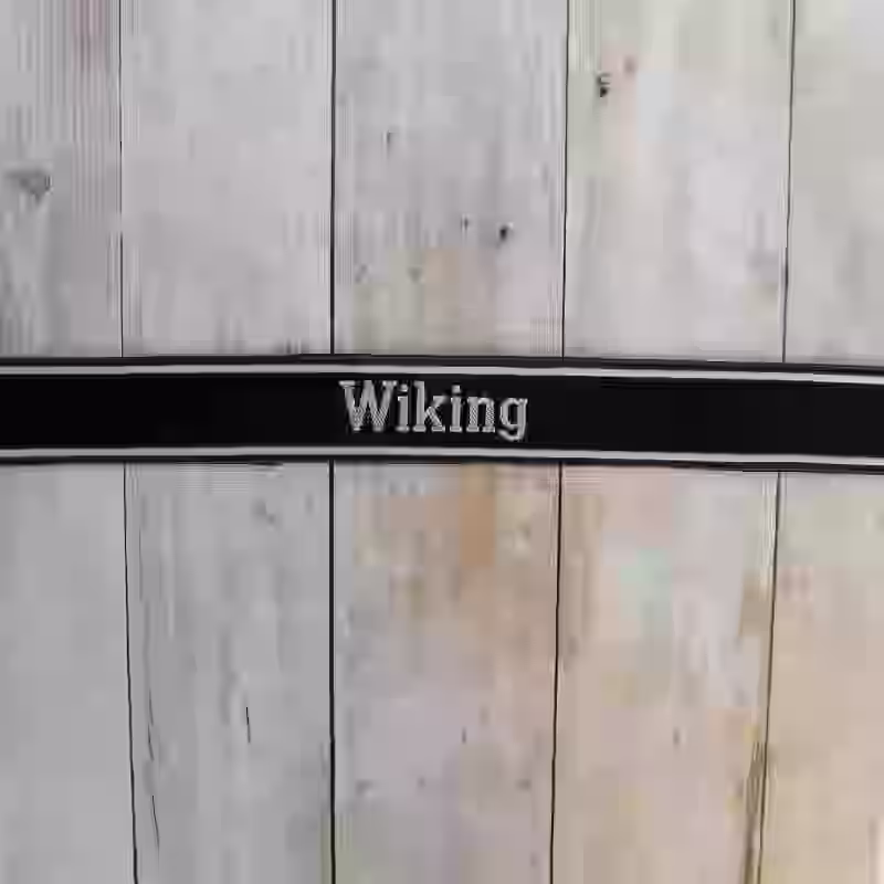 Wiking EM Cuff Title - WWII-era Wiking enlisted men’s cuff title with grey thread on black woven silk base for 5th SS Panzer Division.