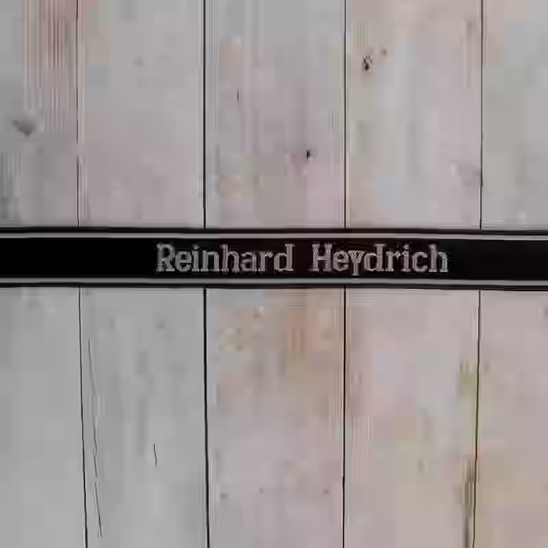 Reinhard Heydrich EM Cuff Title - WWII-era Reinhard Heydrich enlisted men’s cuff title with grey thread on black woven silk base for SS security units.