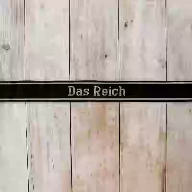 Das Reich EM Cuff Title - WWII-era Das Reich enlisted men’s cuff title with grey thread on black woven silk base for 2nd SS Panzer Division.