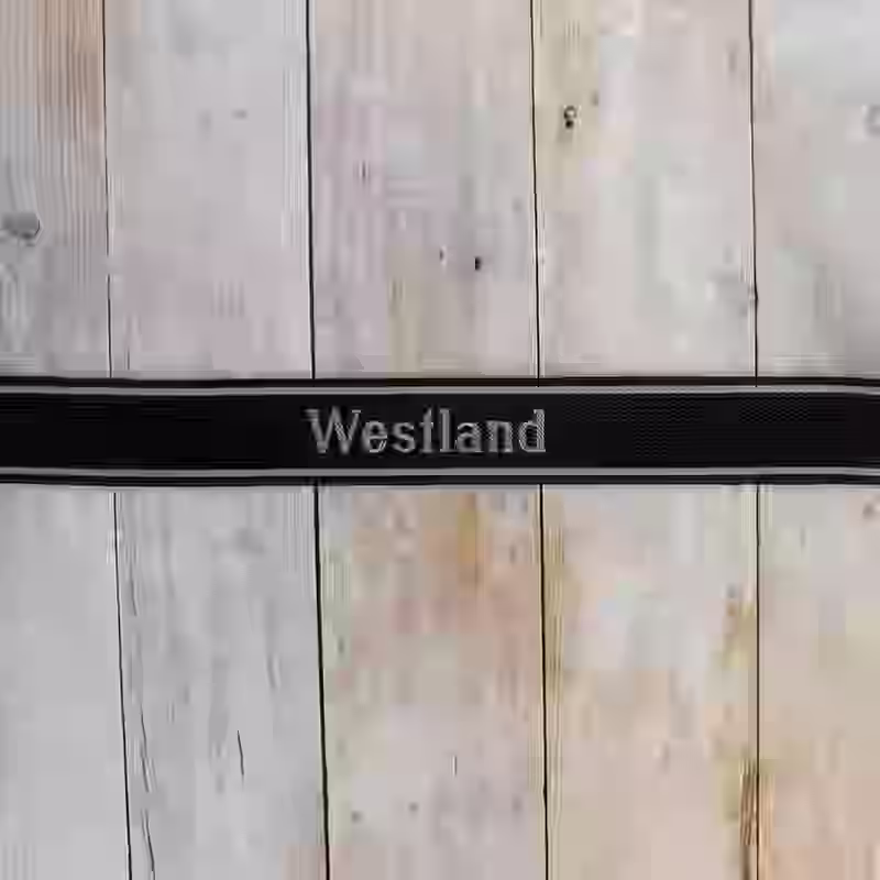 Westland EM Cuff Title - WWII-era Westland enlisted men’s cuff title with grey thread on black woven silk base for Wiking Division’s Westland Regiment.