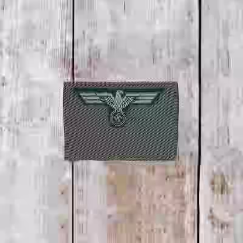Wehrmacht Army Enlisted Men’s Silk Woven Cap Eagle - WWII-era Wehrmacht army enlisted men’s silk woven cap eagle in Be-Vo style with white eagle on dark green background, 1939 design.