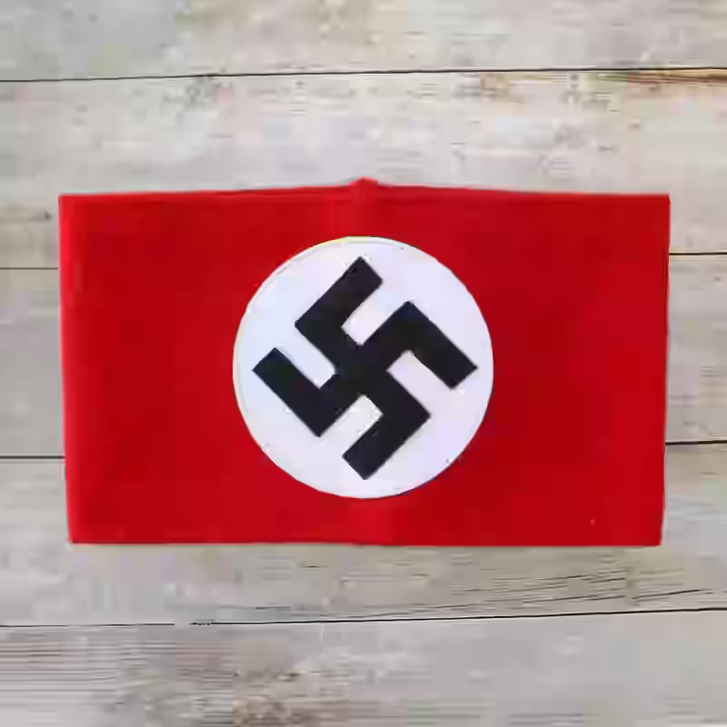 NSDAP Armband - WWII-era NSDAP armband with machine-embroidered swastika on red wool.