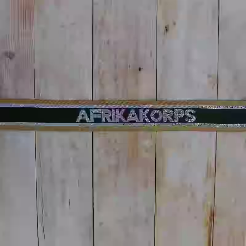 DAK Afrika Korps Wehrmacht Enlisted Men's Cuff Title - WWII-era DAK Afrika Korps enlisted men’s cuff title with silver embroidered lettering on tan and green silk.